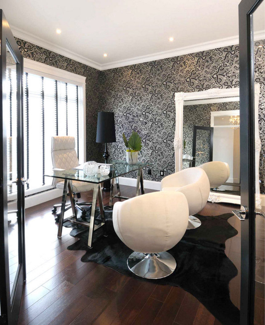 Solid black cowhide rug office interior